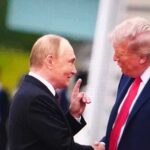 Two political leaders shaking hands during a meeting