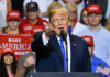 Trump’s War Reversal Shocks MAGA Base Man speaking at rally with crowd behind him