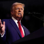 Trump’s Stark Warning: “We Will Remember” Reluctant Allies Man speaking at a podium with microphone