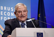 Man speaking at Brussels Economic Forum podium