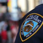 NYPD officer uniform badge closeup in NYC