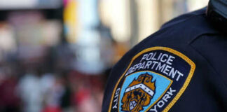 NYPD officer uniform badge closeup in NYC