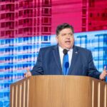 A government official delivering a speech at a conference