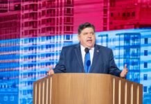 Epstein Deposition Clip ERUPTS: Clinton Names Pritzker A government official delivering a speech at a conference