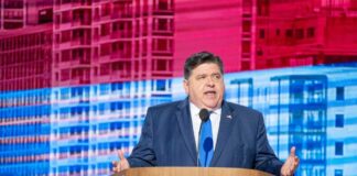 A government official delivering a speech at a conference