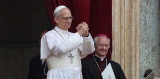 Pope giving a blessing from a balcony