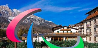 Colorful Paralympic symbol sculpture in a mountainous resort area