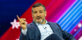 Person speaking on stage with colorful background