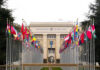 United Nations building with international flags displayed outside