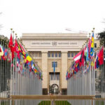 United Nations building with international flags displayed outside