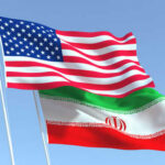 Pentagon’s Shocking 2026 Iran Timeline Leak American and Iranian flags waving in the sky.