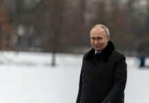 man in black trench coat