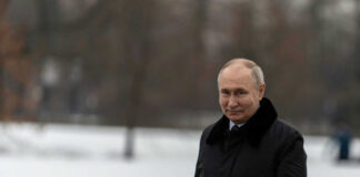 man in black trench coat