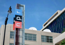 NPR building with logo and streetlight nearby