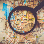 A map of Salt Lake City, Utah, viewed through a magnifying glass