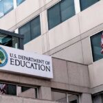 Exterior view of the U.S. Department of Education building with an American flag