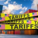 Yellow caution tape with the word 'TARIFFS' over a background of shipping containers