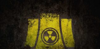 Yellow radiation symbol on a dark, textured background