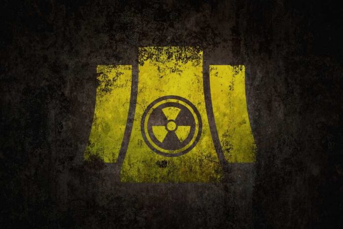 Yellow radiation symbol on a dark, textured background