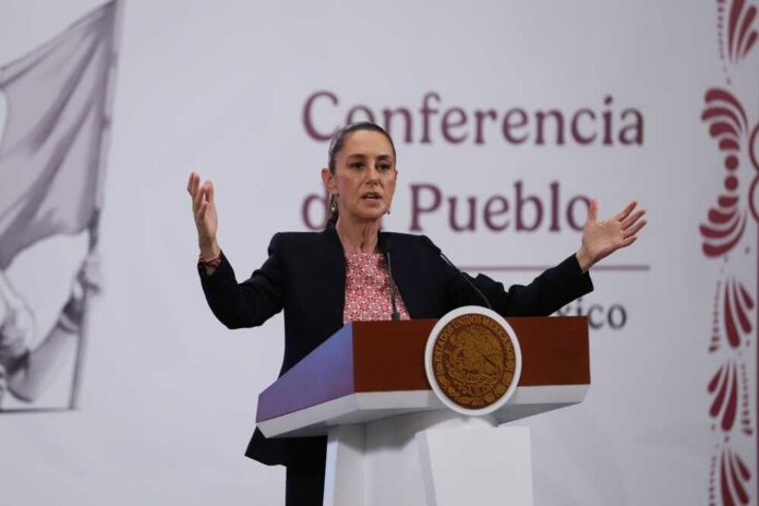 A government official speaking at a podium during a conference