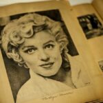 Black and white vintage photograph of a woman with curly hair, resembling Marilyn Monroe
