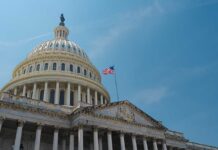 Congress in CRISIS: Bipartisan EXPULSION Drama The U.S. Capitol building with an American flag flying against a blue sky
