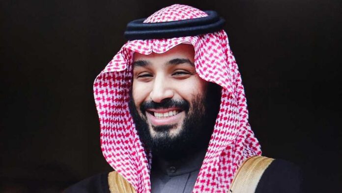 shutterstock_2688127299.jpg A man in traditional Saudi attire smiling at the camera