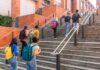 Group of students ascending outdoor stairs on a campus