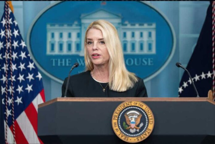 A government official speaking at a podium in front of the White House seal