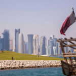 Qatar’s $62B University Influence EXPOSED! Doha skyline with Qatar flag and dhow boat