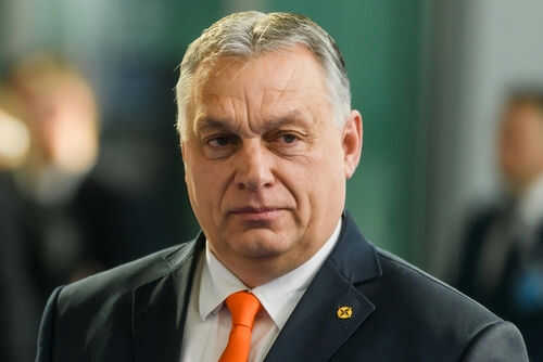 viktor-orbn-hungary-pm2139268667jpg Man wearing suit with orange tie indoors