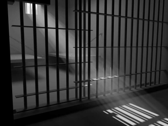 Sunlight streaming through prison cell bars.