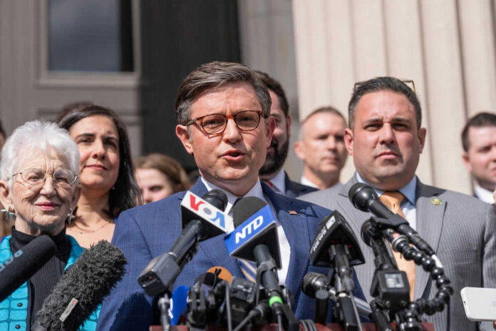 Group of people speaking at a press conference.