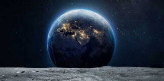 Earth rising above the moon’s barren surface in deep space