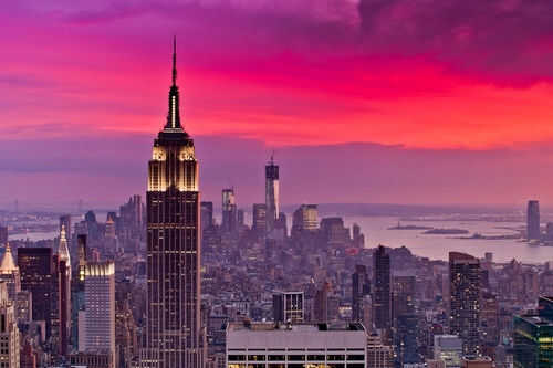 City skyline at sunset with colorful sky