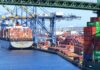 Tariff Turmoil: Trump’s Strategy COLLAPSES in Court! A cargo ship loaded with colorful containers docked at a busy shipping port