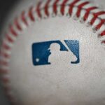 Close-up of a baseball featuring the MLB logo