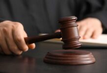 Judges Auditioning? SCOTUS Drama Explodes A judge's hand holding a gavel above a wooden block