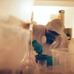 Shocking Cartel Move: Mexico’s Drug Cooks in Africa? Scientist in protective gear mixing substance in a lab