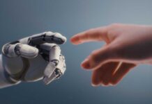 A robotic hand reaching out to touch a human hand