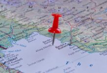 Oil Slick CATASTROPHE Threatens Global Supply A red pushpin placed on a map indicating a specific location