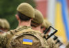 Ukraine’s War Ditches High-Tech for LEGO-Like Weapons Soldiers with backpacks and Ukrainian flags in formation