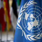 United Nations flag with world map emblem displayed