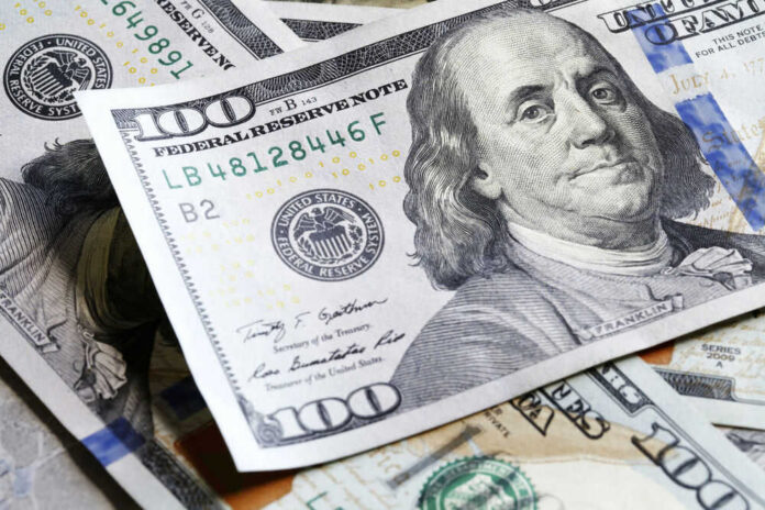 us-money121128056 Several US one hundred dollar bills
