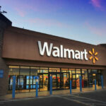 Walmart’s WARNING: Hard Times Ahead? Front entrance of a Walmart store at dusk.