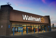 Walmart’s WARNING: Hard Times Ahead? Front entrance of a Walmart store at dusk.
