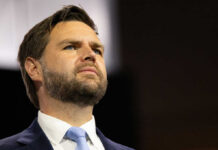 High-Stakes Iran Gamble Puts Vance On The Line Man in suit and tie looking upward