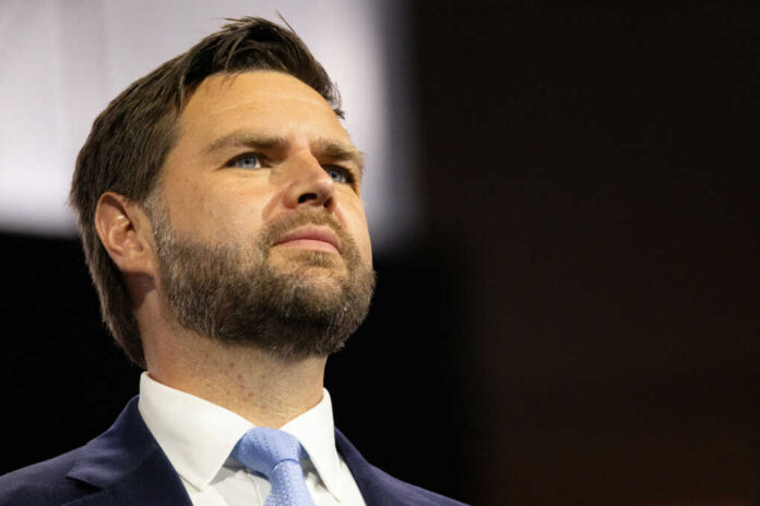 jd-vance2497649809jpg Man in suit and tie looking upward