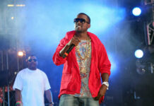 Italy Cancels Kanye Shows—Safety Concerns Follow Istanbul Crowd Two performers on stage with microphones and lights