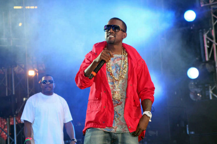 kanye-west268231024jpg Two performers on stage with microphones and lights